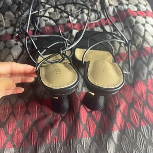 Black heels that tie around legs